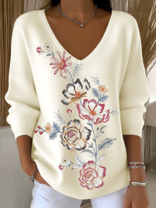 Damski sweter z dekoltem w szpic z kwiatowym haftem