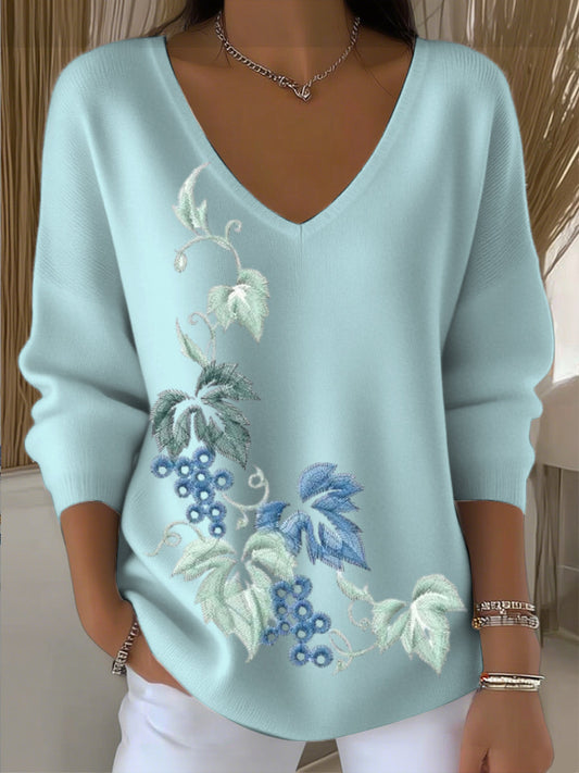 Damski niebieski kwiatowy sweter z dekoltem w szpic