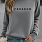 Damska swobodna bluza z nadrukiem amerykańskiej flagi „ Wolność nie jest darmowa”