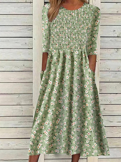 Damska kolorowa sukienka z krótkim rękawem w stylu retro w kwiatowy wzór w talii