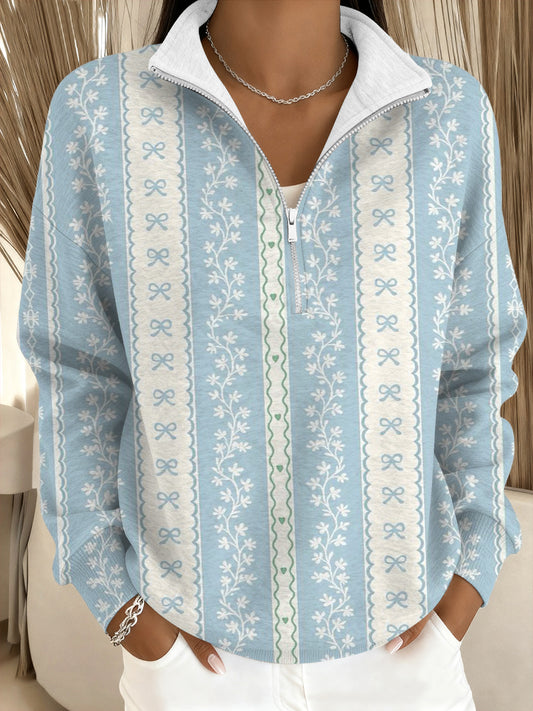 Damska bluza z delikatnym niebieskim kokardką i kwiatowym kołnierzem